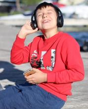 boy listening to headset